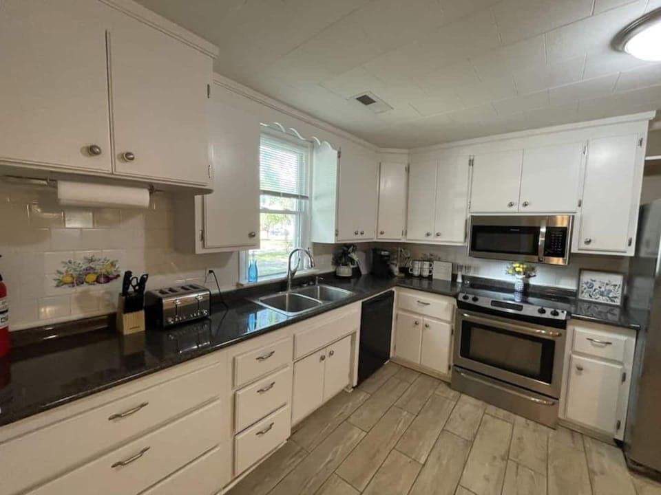 Kitchen has pots and pans to cook meals