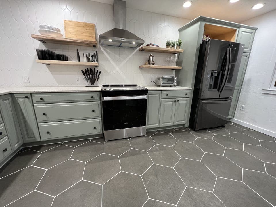 Newly renovated kitchen that opens into dining room with countertop bar seating.