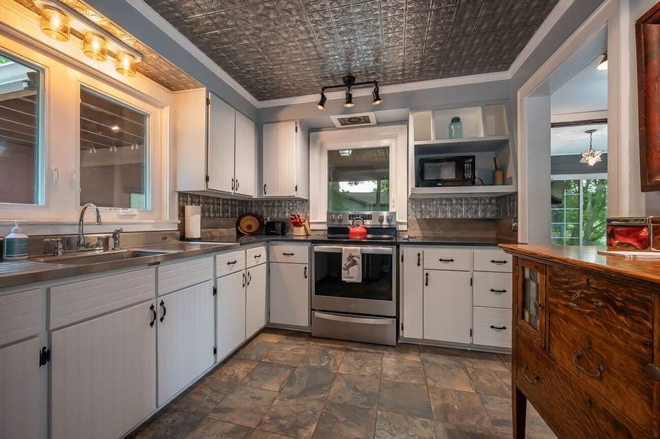 Kitchen is equipped with an electric smooth top range