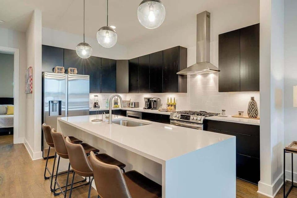 Modern kitchen with stylish seating, ideal for whipping up your favorite dishes