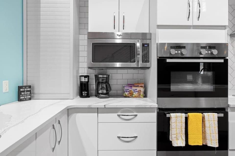 Complete chef's kitchen with coffee bar, double oven, and microwave. 