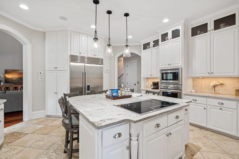 Updated kitchen with island seating and a pantry.