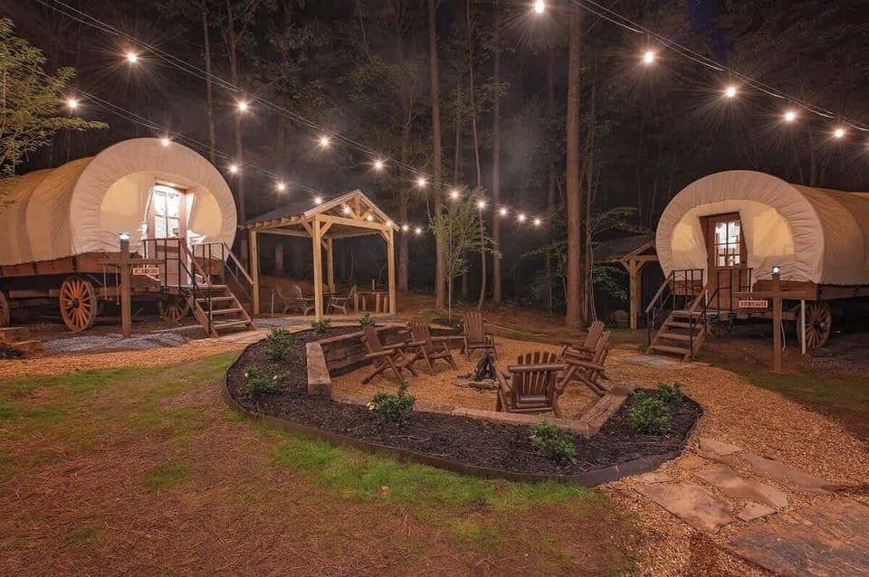 Our 3 Glamping Wagons are corralled around a community fire pit.