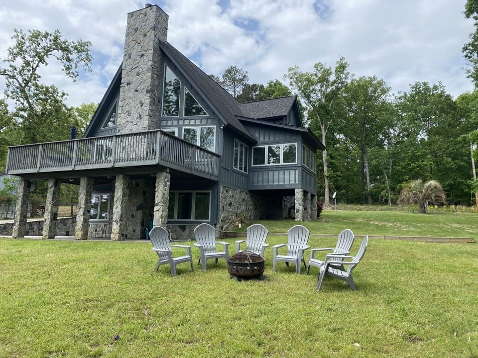 Lovely deck with grill and table up top.  Patio below. Firepit onsite as well