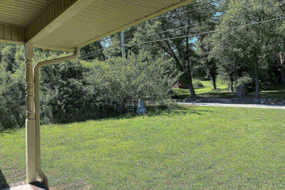 Enjoy the covered front porch and level front yard on a quiet dead-end street