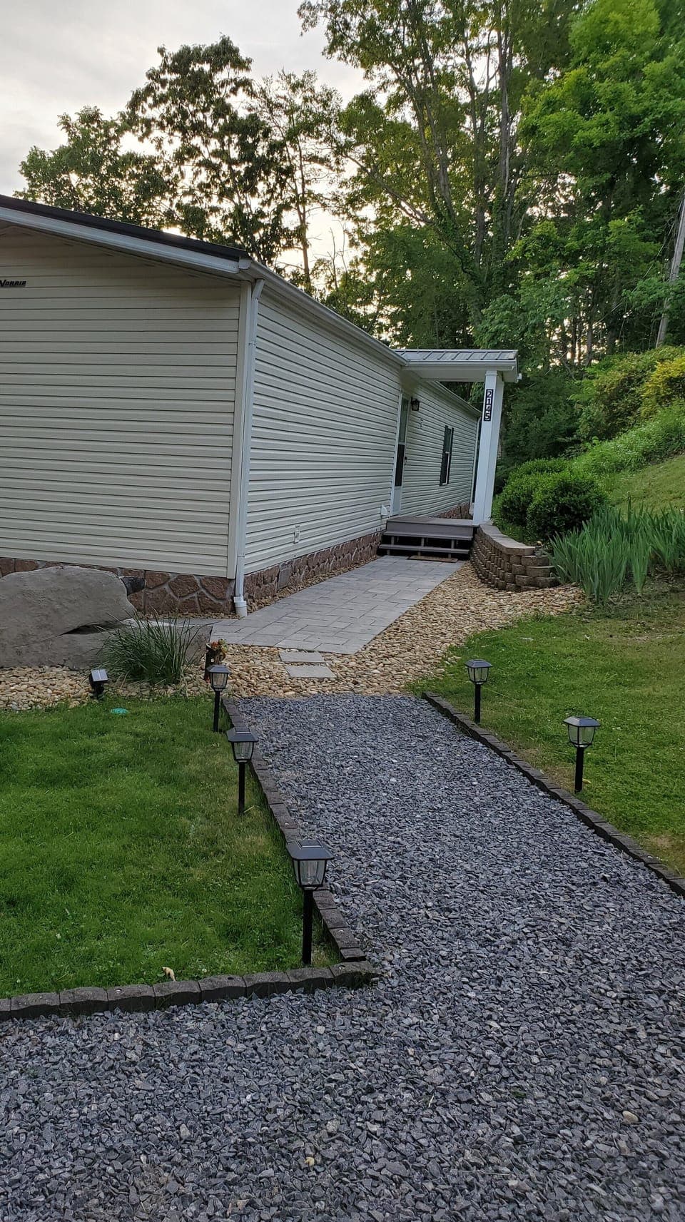 front entrance - gravel drive, brick paver walk way  