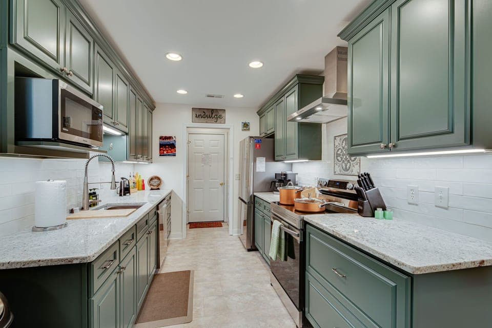 Shine like a chef in the bright gourmet kitchen of Sage Green cabinets