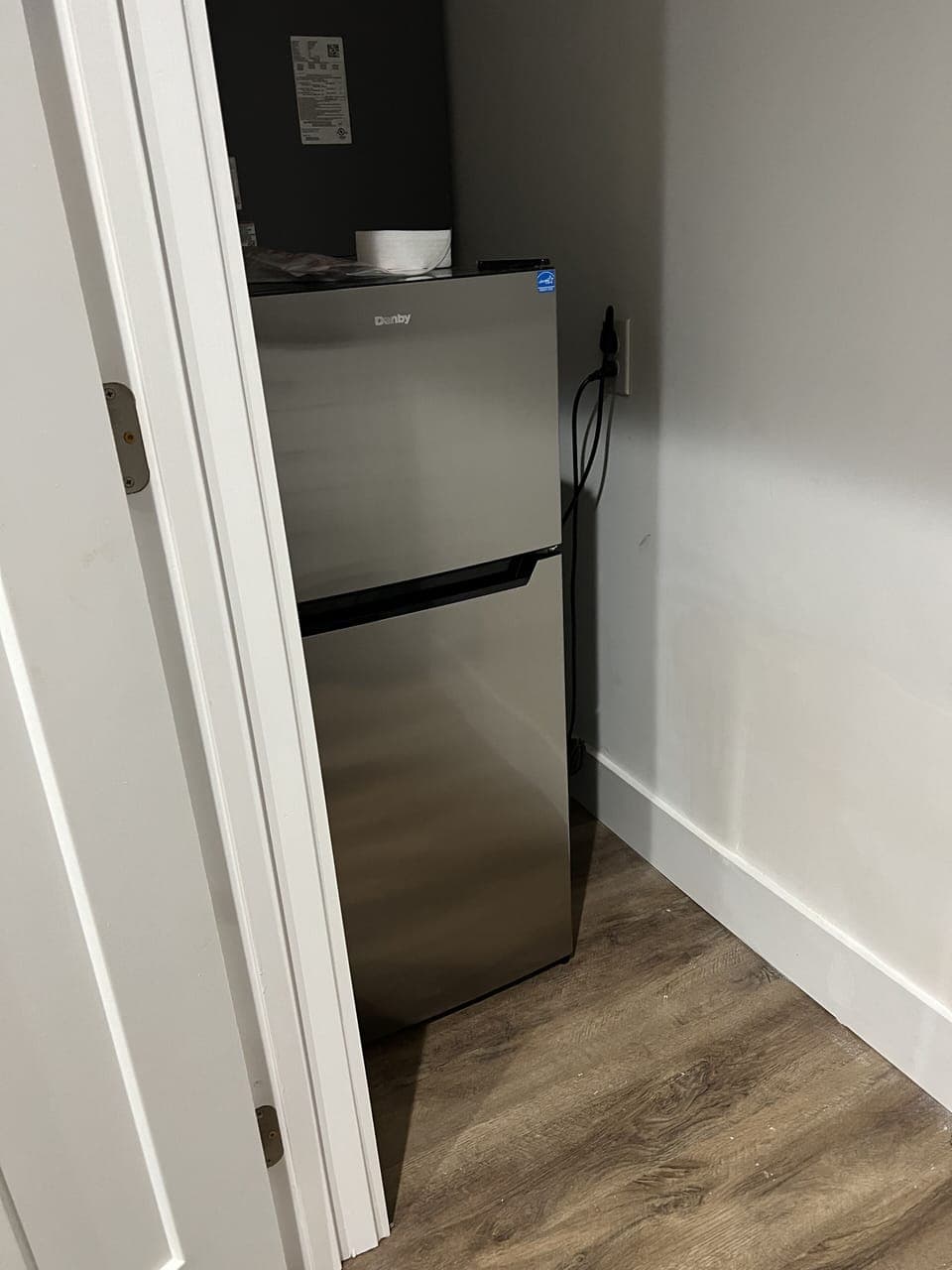 Small fridge in entertainment area