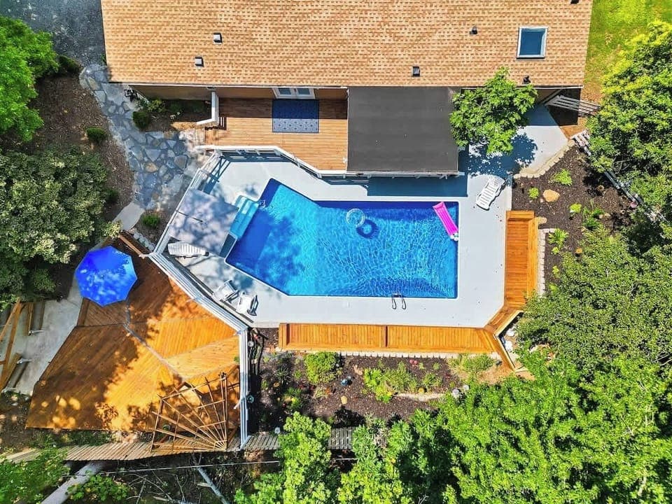 No summer day will be wasted in this backyard! In ground pool, several different areas for seating and space for everyone to spread out and relax