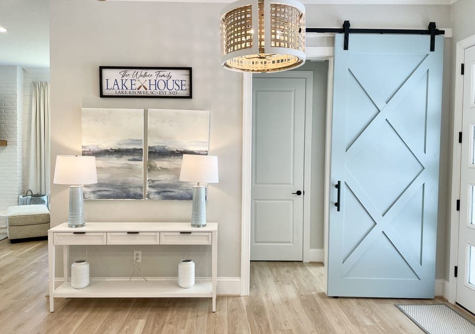 Barn door closes to create another private guest suite  with king bed