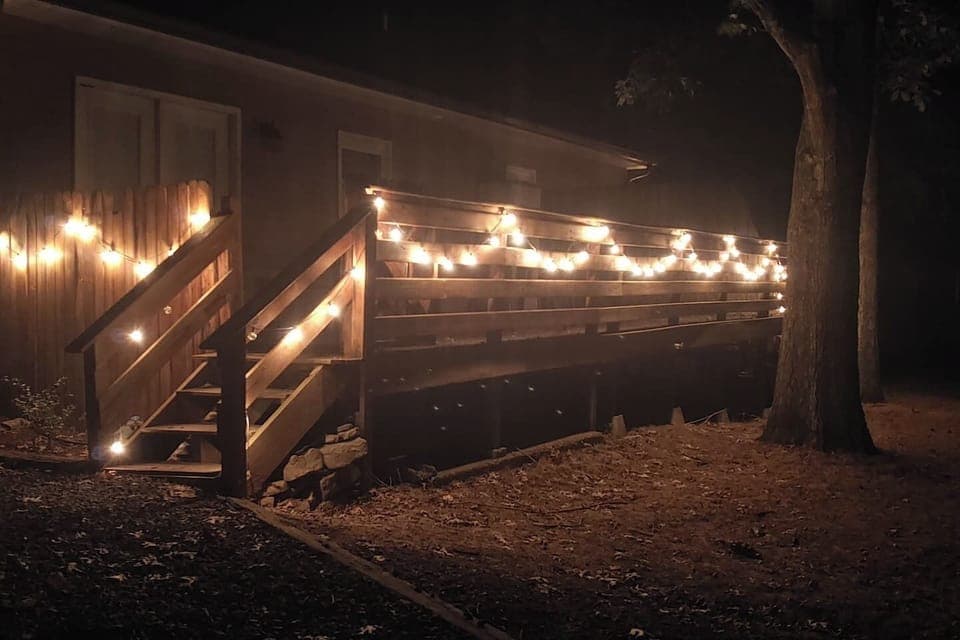 Relax on the large private back deck under the trees.  