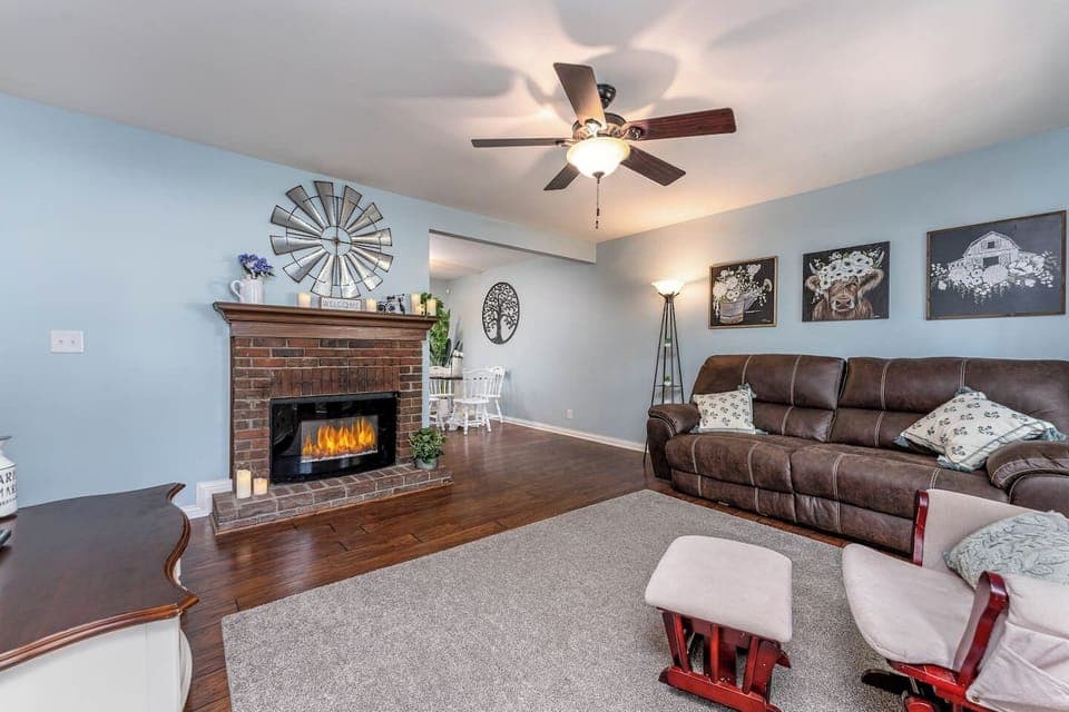 Reclining couch and electric fireplace.