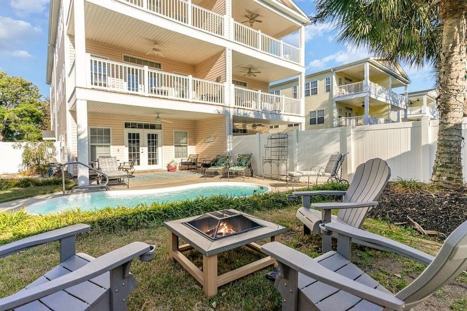 Tranquil outdoor space with private pool and outdoor dining and lounge areas