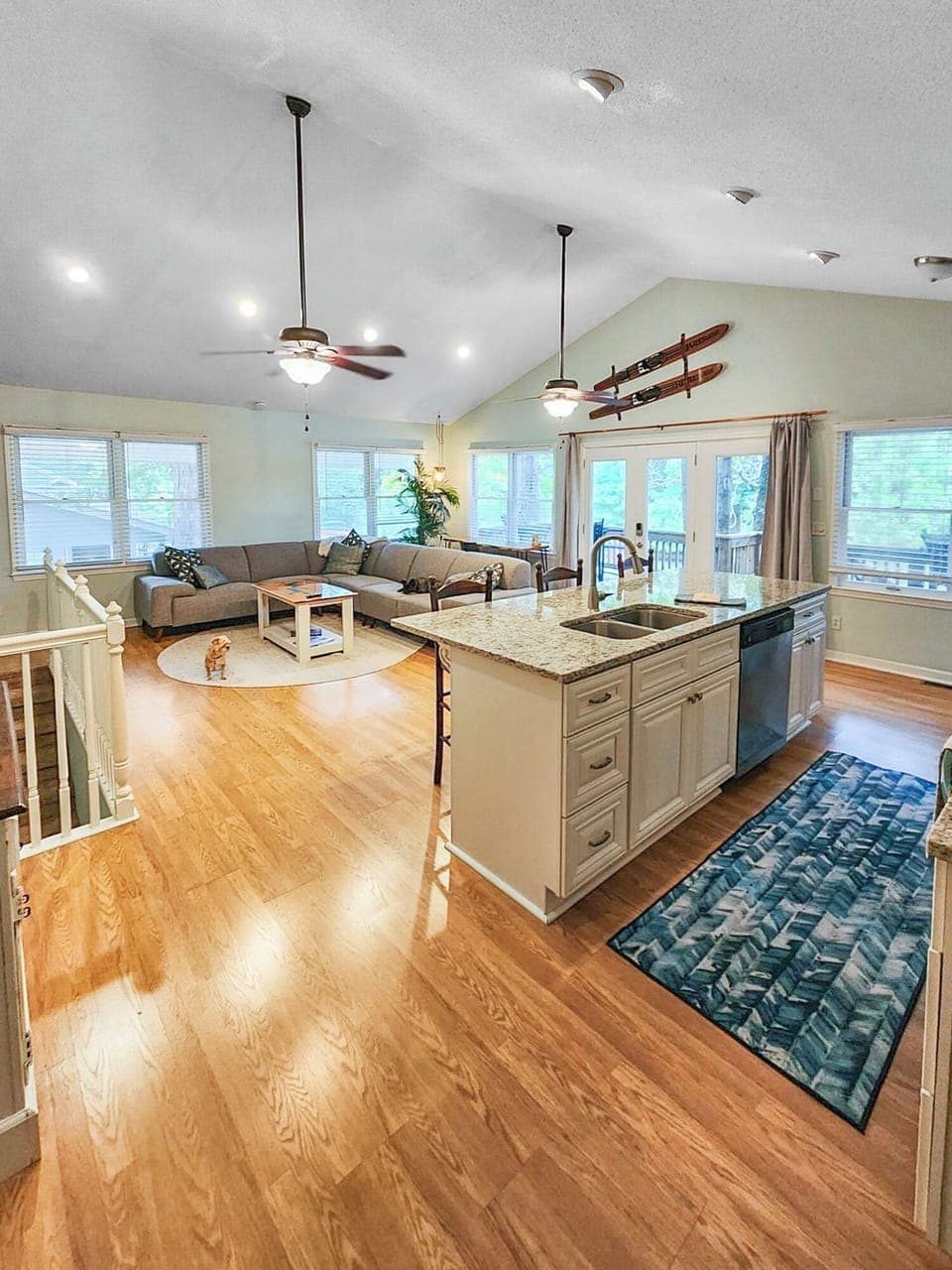 Walking in from our side door into the main living room and open kitchen.