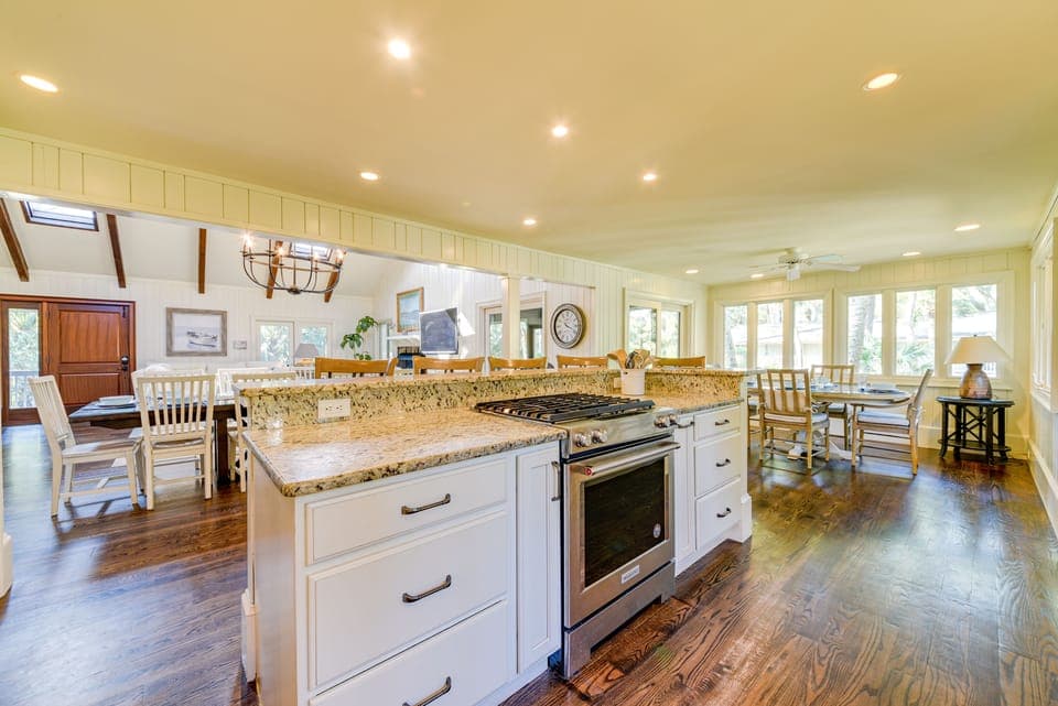 The Chef's Kitchen looks out to Dining and Living Areas.