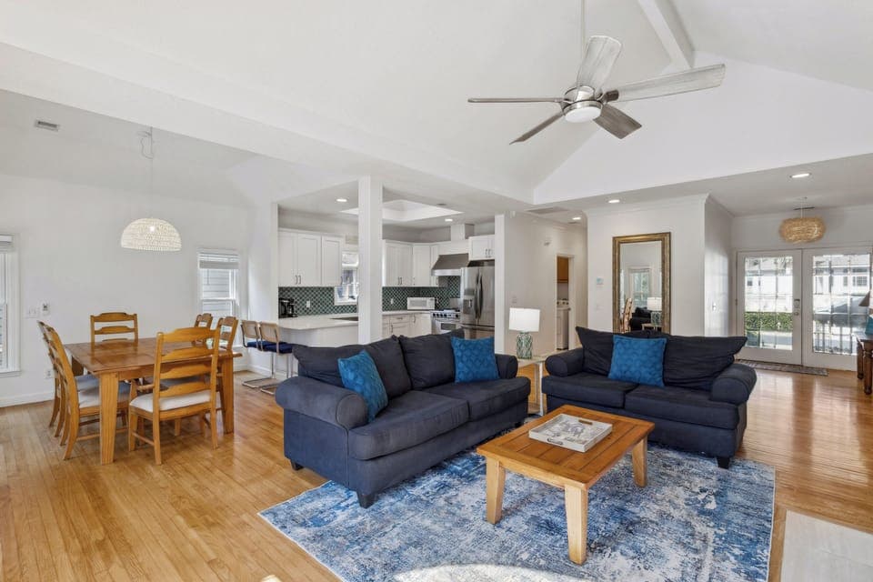Living room featuring a flatscreen tv and a queen sleeper sofa.