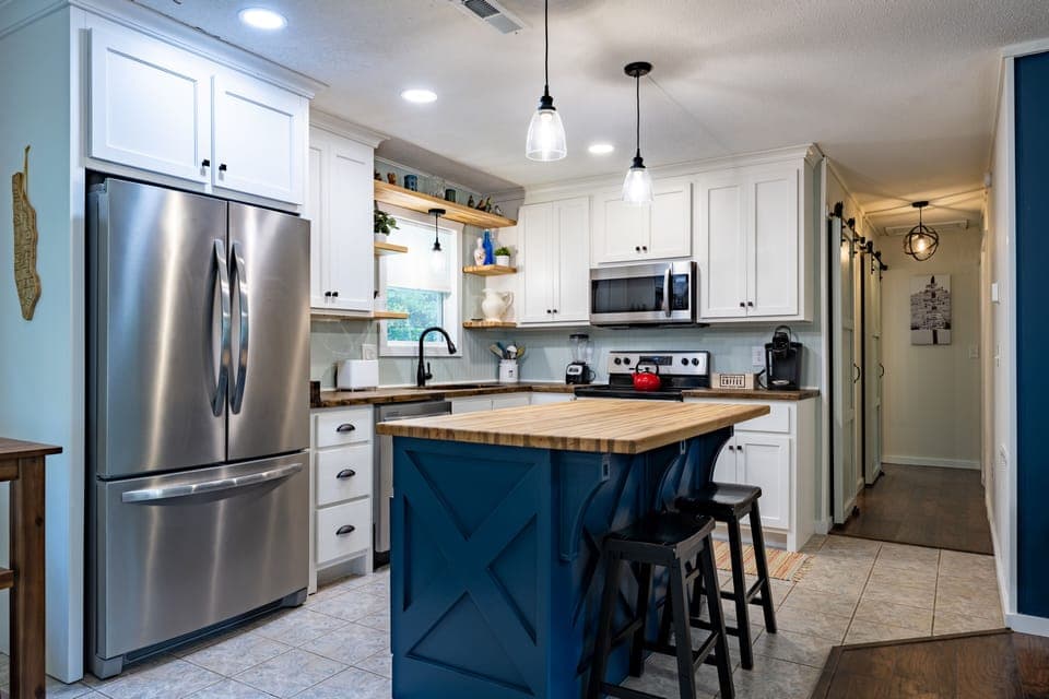 Fully stocked kitchen with Keurig, blender, toaster, and more