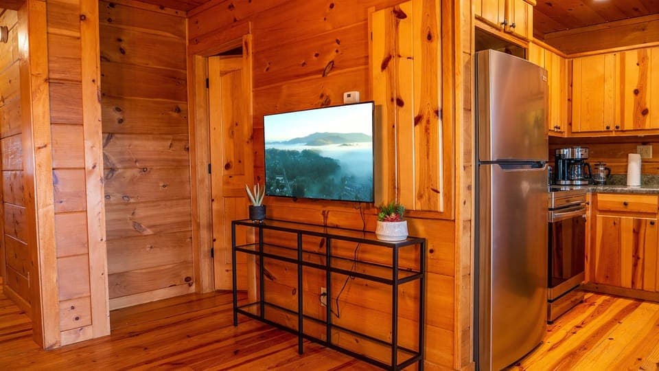 The dining area has a 50-inch smart tv so you never have to miss a minute of your show or team's game!