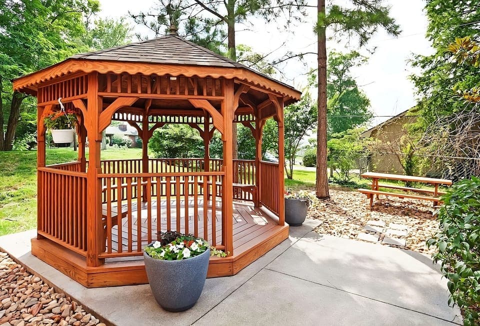 Unwind under the charming gazebo with peaceful garden views.