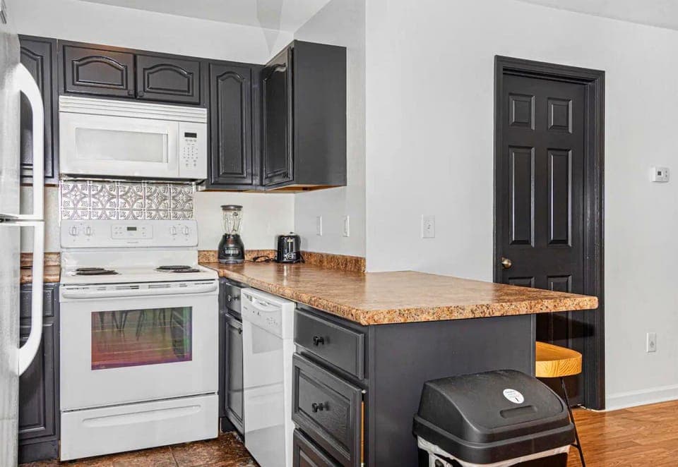 Our kitchen bar is the perfect spot for a quick bite or a chat over coffee, right in the heart of the home."