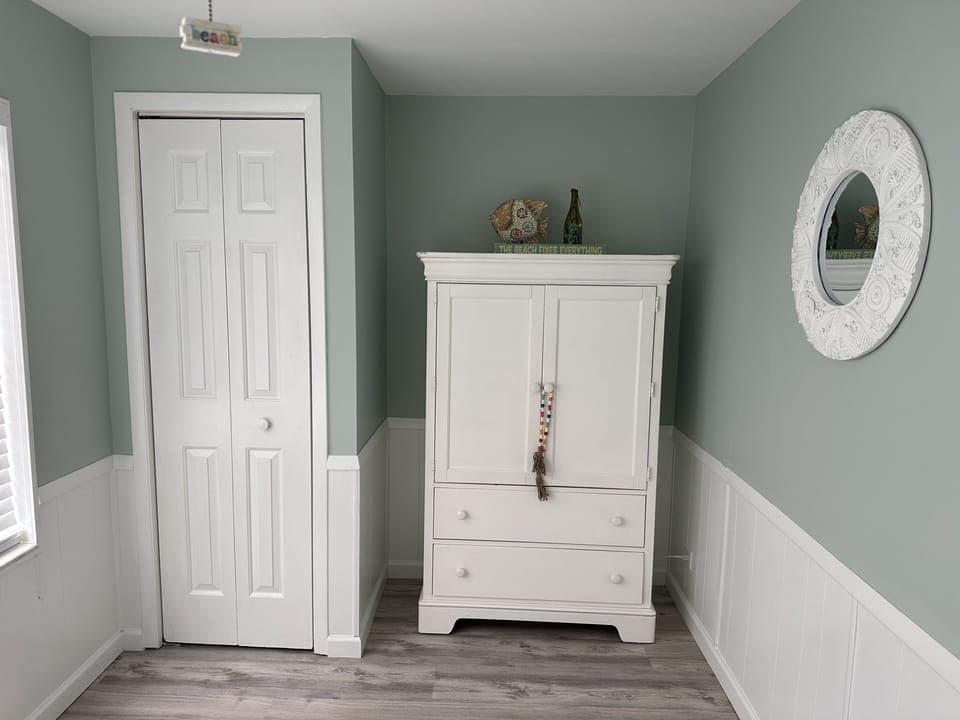 Queen bedroom with closet and tv armoire/dresser