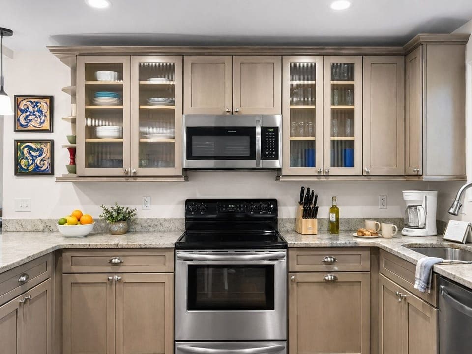 Your fully equipped kitchen awaits with granite countertops, stainless appliances, and ample cabinet space for all your culinary adventures.
