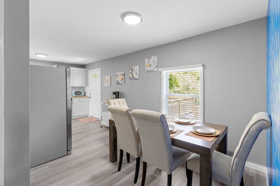 The dining room table has ample seating for 6 people.