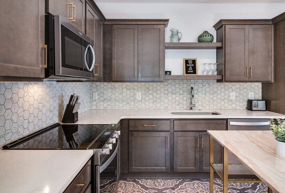 Whip up culinary delights in our sleek and modern kitchen, where every meal becomes a masterpiece.