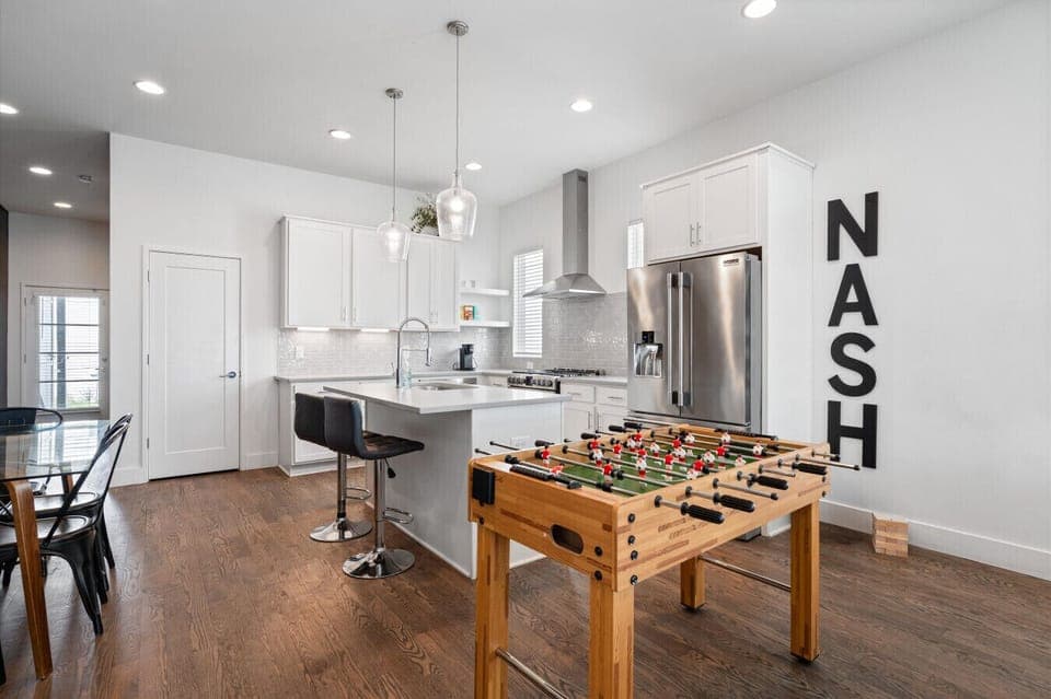 Open-concept kitchen with Foosball table—perfect for hanging out between plans.