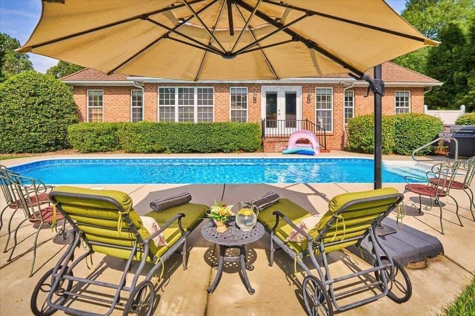 Relax and enjoy the pool with a cold beverage