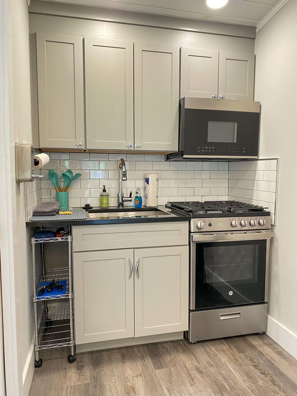 Full kitchen with Gas Stove, full size microwave & the Essentials 
