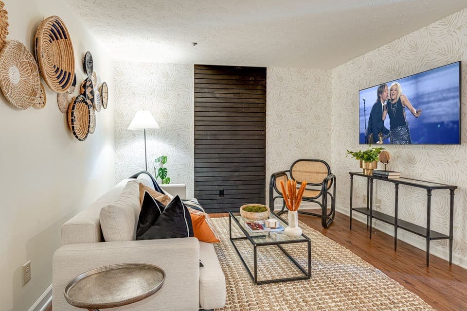 Stunning bohemian designed home with bright living space and designer furnishings. Features smart TV.