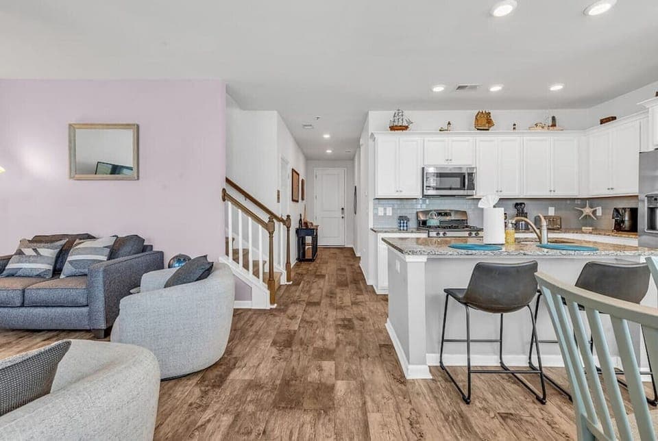 Enjoy an open floor plan on the first floor with kitchen, living, and dining spaces