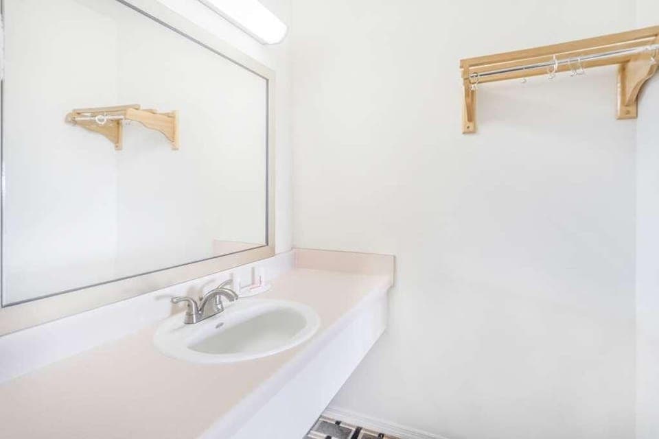 Bathroom with shower and tub. Basic toiletries and towels are provided