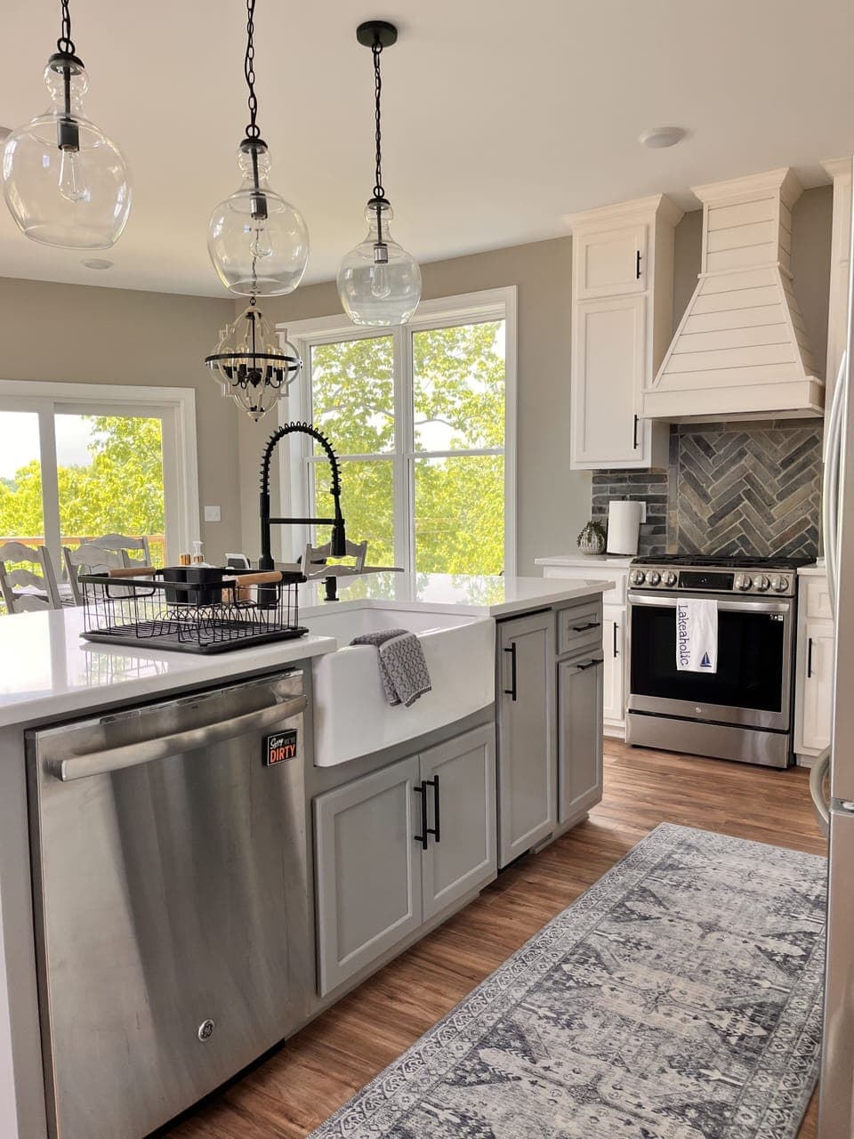 Beautiful farmhouse sink, dishwasher, and under the counter ice maker 