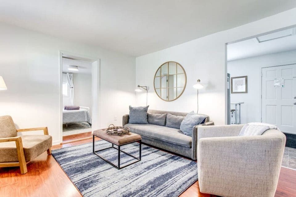 Spacious, airy living-room. The couch folds out into a full size futon.