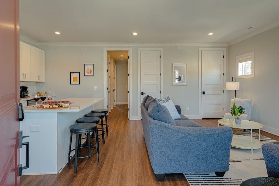 Bright and open living space with smart TV. -Unit 1-