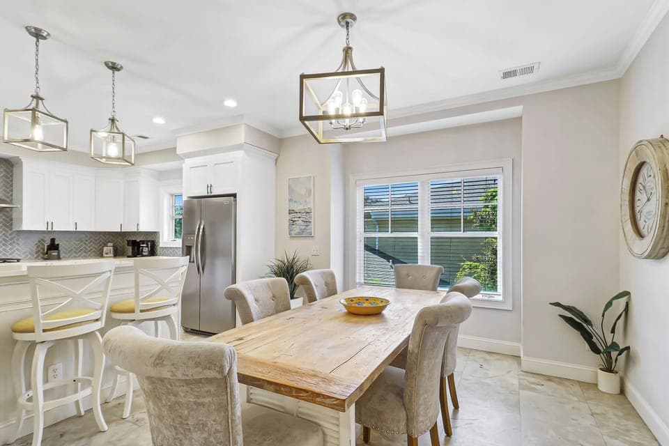 Gather around your elegant dining table where warm wood meets soft textures, creating the perfect space for memorable meals together.
