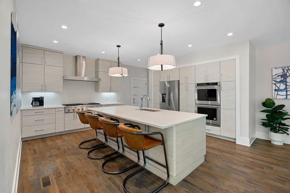 Fully stocked kitchen with island seating for 4.
