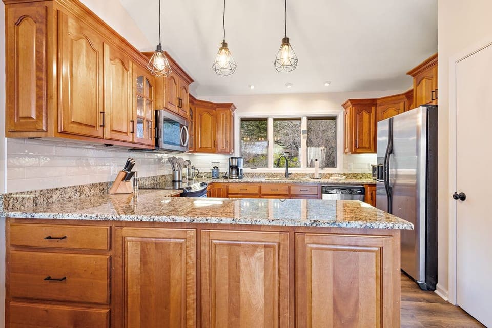 Large Fridge and Nice Kitchen Lighting