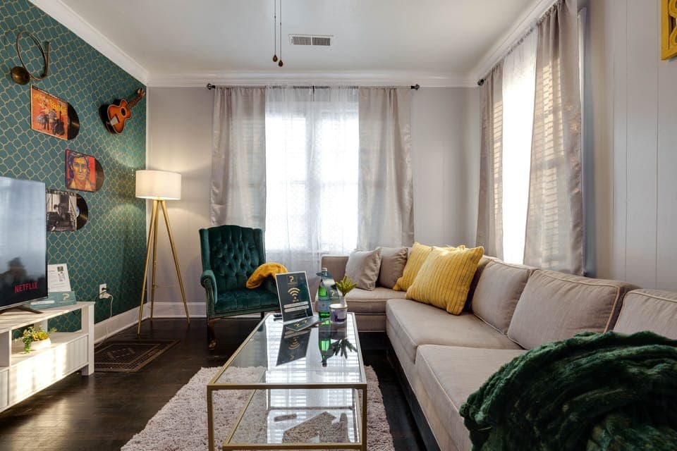 LIVING ROOM (music room) features 58 inches smart TV and a sleeper sofa
