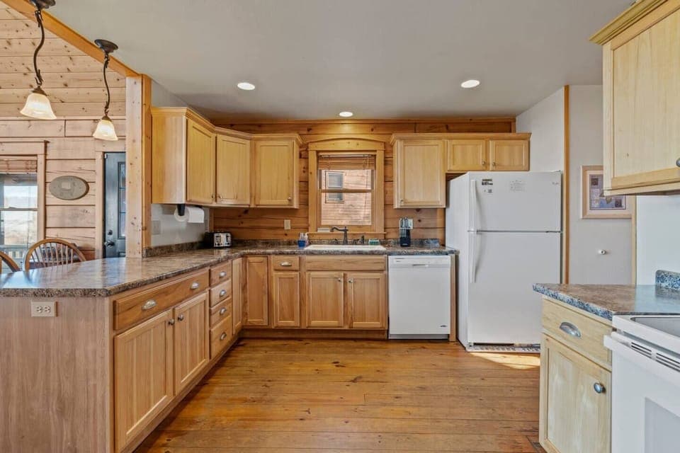 Open kitchen with seating at the island.