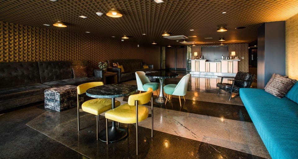 Kick back in a speakeasy-style lounge with intimate evening ambiance.