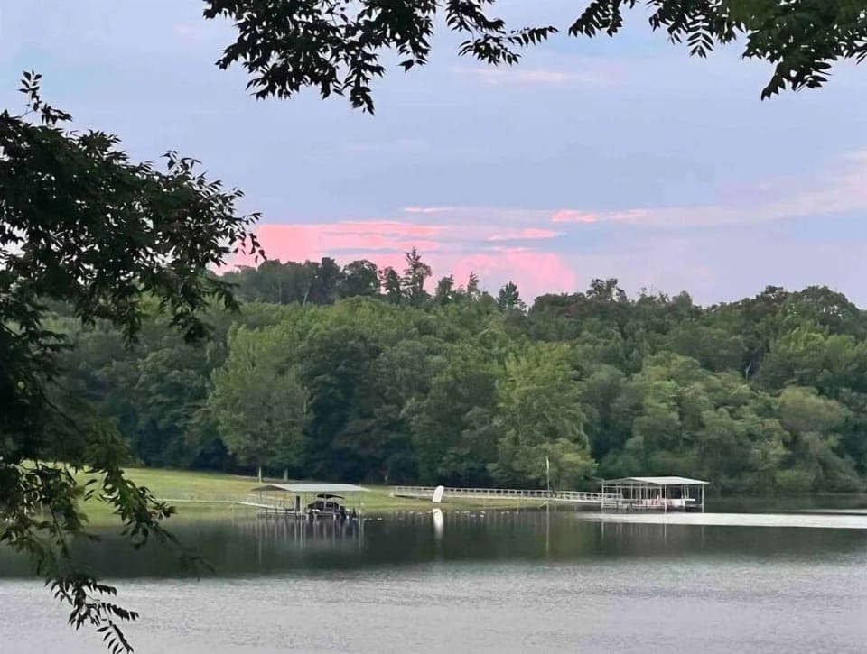 Lovely sunsets over the trees and water.