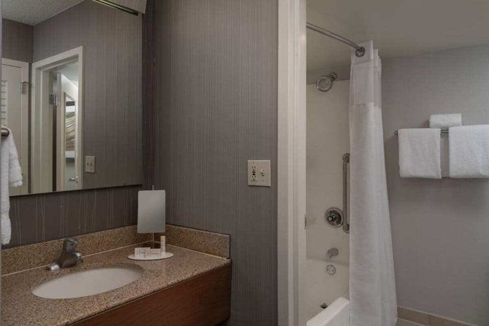 Full bathroom with a shower/tub. Basic toiletries and towels are provided