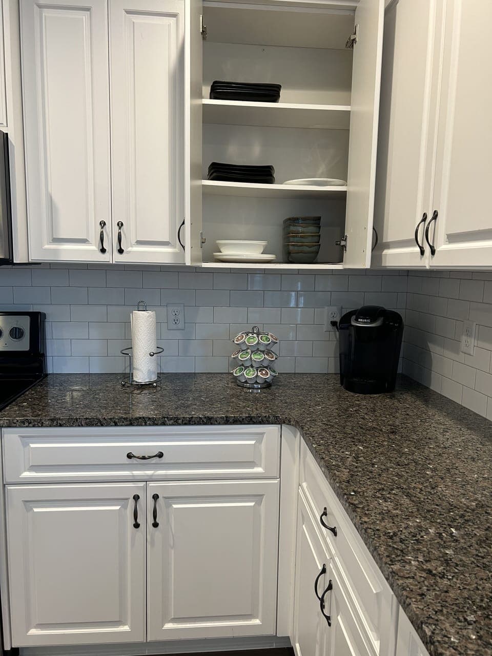 Keurig w/pods and provided eating utensils, plates, bowls