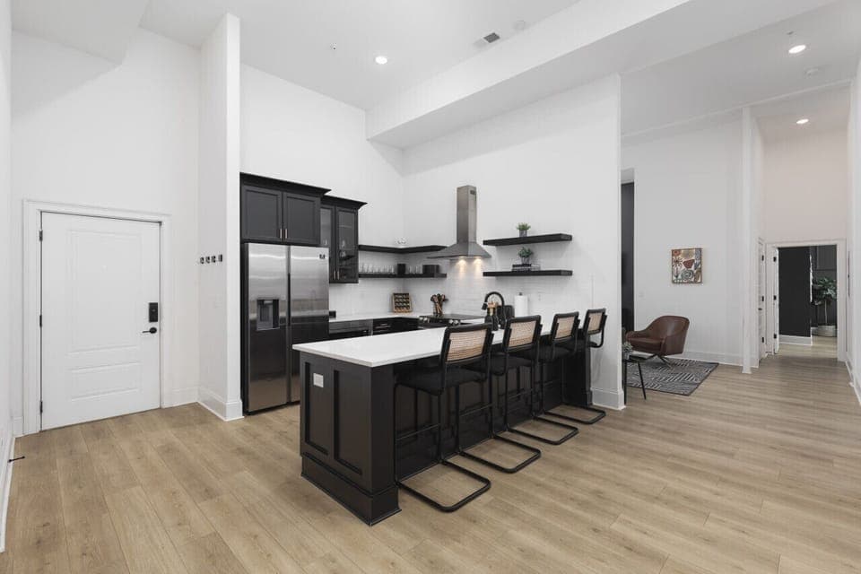 The kitchen is fully stocked with high-end appliances and every utensil, dish, and spice you might need to make a meal. Seating for four available at the counter.