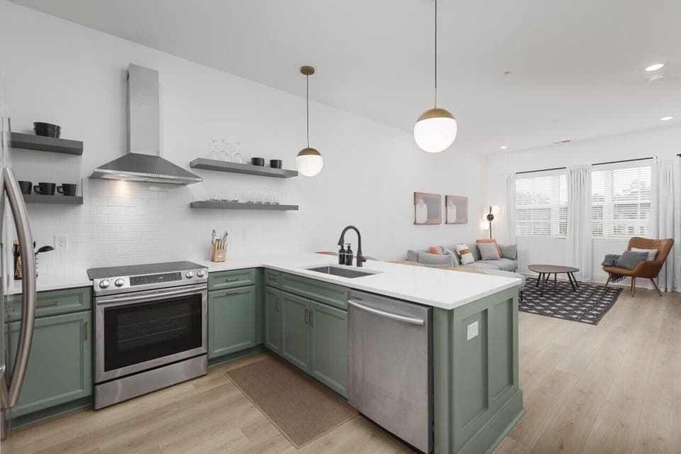 Open floor plan with lots of natural light and seating for 4 at the kitchen counter.