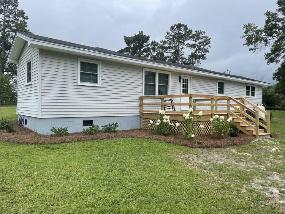 Rear of house.  Have added gutters and painted porch since this picture.