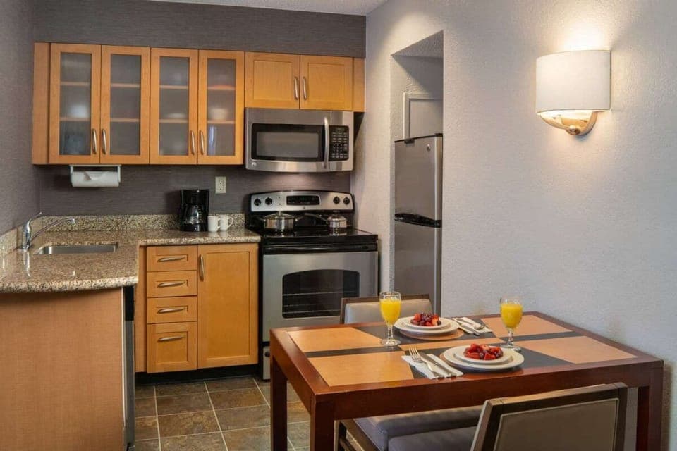 Sip morning coffee at a cozy table beside the kitchen.